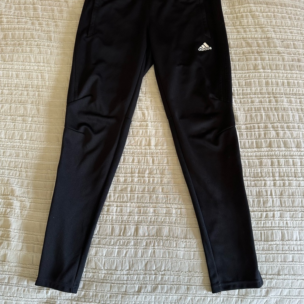 Lightly used. Adidas women’s black track pants with 3 strips on side.